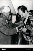 H.H. The Aga Khan decorated with the National Order Cross of Malagasy, in the presence of Mrs. Tsiranana and other celebrities.